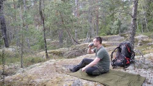 Hiker Resting on Mat in Quiet Pine Forest
