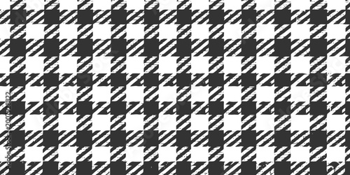 Distressed black and white houndstooth pattern with grunge texture effect for vintage fashion design textile print and retro aesthetic background in high resolution