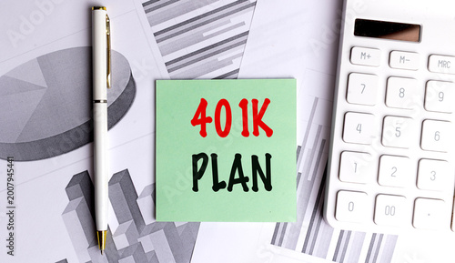 401k plan concept with sticky note calculator pen and financial charts on desk retirement savings and investment