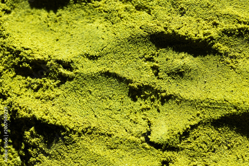 textured surface of green matcha powder  natural background perfect for health, food, or branding visuals