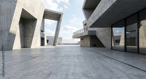 Concrete structures create unique shapes and lines in an open space during daylight at a modern architectural site