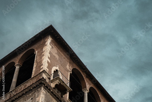 Dramatic Moody Ancient Stone Building Corner with Stormy Sky and Copy Space Background