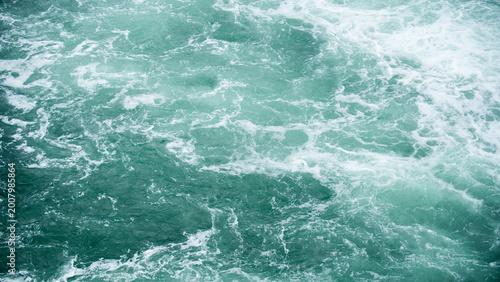 Water background. Water texture background. Surface of ocean water. Blue sea texture. Aqua water surface.