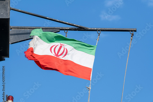 Iranian flag on the mast on vessel. Flag of Iran on ship. Iranian ensign.