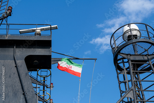 Iranian flag on the mast on vessel. Flag of Iran on ship. Iranian ensign.