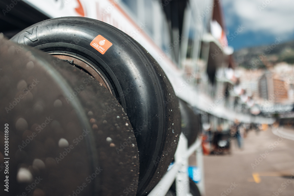 Fototapeta premium Racing tires stacked in motorsport paddock at race circuit