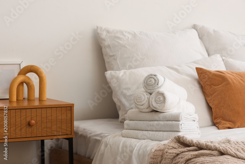 Clean towels on bed in room