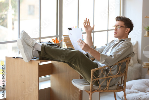 Male screenwriter reading s...