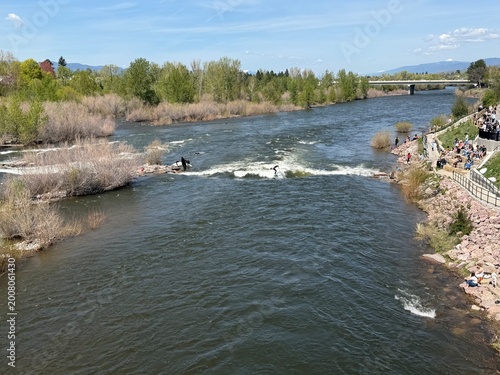 River surfer at Brennan's Wave on Missoula's Clark Fork River at Caras Park.  