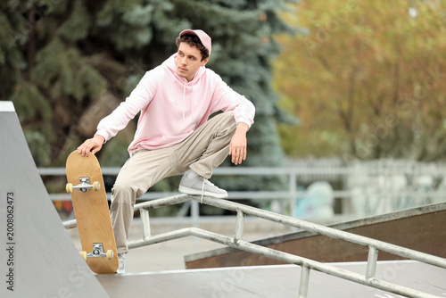 Handsome young man with ska...