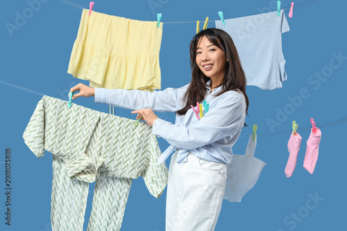 Happy young Asian woman han...