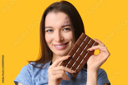 Young woman with chocolate ...