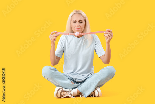 Mature woman with mouth gag...