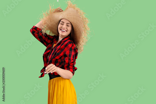 Young woman on green backgr...