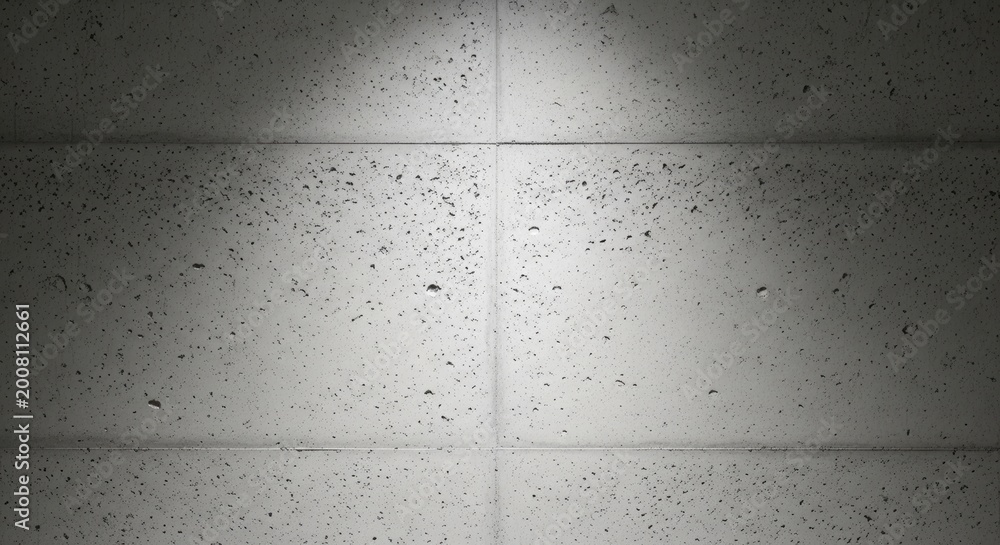 Obraz premium Gritty gray concrete wall texture showcasing fine aggregate details, gently illuminated by soft overhead light, forming a modern industrial backdrop