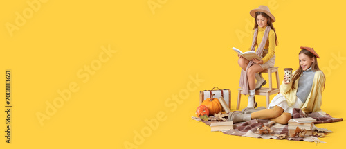 Cute girls in autumn clothe...