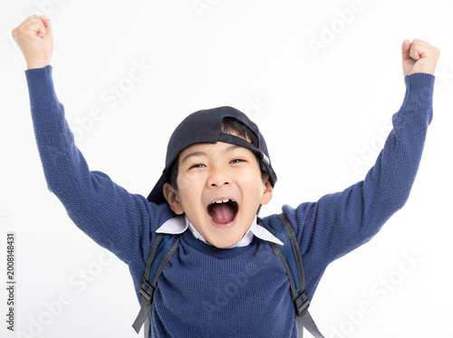 Excited Little boy wearing baseball cap isolated on white