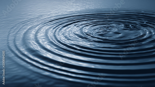 Water ripples create concentric circles on the surface of calm water