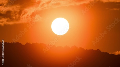 Peaceful morning time-lapse of sunrise in the mountains, soft clouds moving over a high altitude landscape.