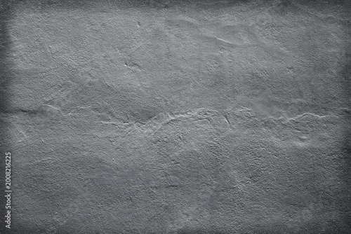 Gray cement wall or light black stone background