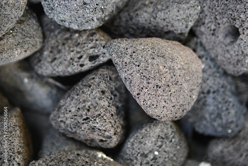 Foto Pumice stones stacked together in a natural setting