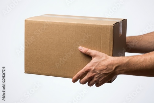 Hands holding a plain brown cardboard box, isolated on a clean white background, ready for shipping.