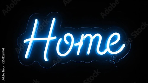 A glowing neon sign displays the word 'Home' in bright blue against a dark background, creating a welcoming atmosphere