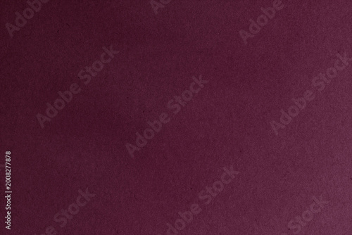 Burgundy textured background with soft paper grain in wine red, maroon, garnet and marsala tones, perfect for elegant premium design and branding.