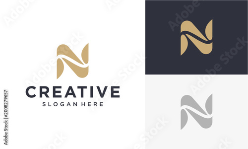 Elegant 'N' letter logo design in gold and navy blue, perfect for branding and creative businesses