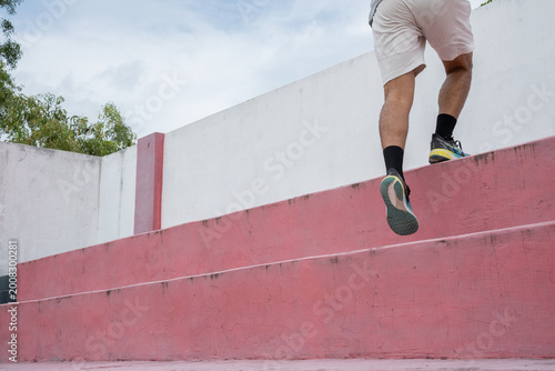 Fotografi running up outdoor steps, Rear view of elderly man in sportswear running quickly