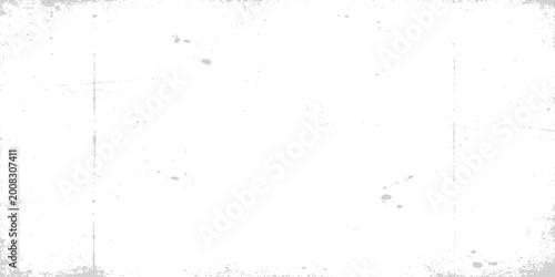 Fotografie Light gray vintage film texture: minimal abstract background with faint dust spo