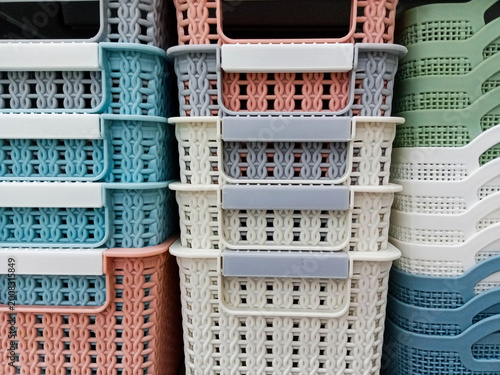 Various Stacked Plastic Storage Baskets with Knitting and Woven Texture