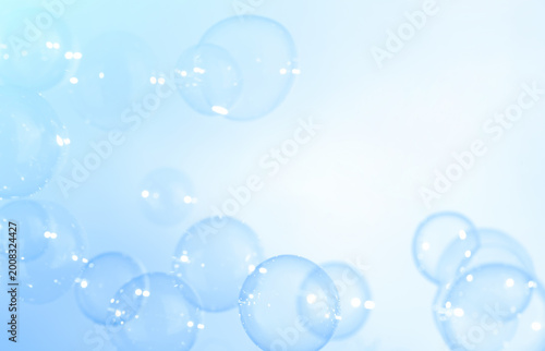 Clear Soap Bubbles Floating on blue Sky. Celebration Festive Backdrop. Freshness Soap Suds Bubbles Water. Blue and White Gradient Textured.