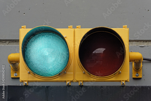 Foto Illuminated green go traffic signal light  on the wall of a parking garage
