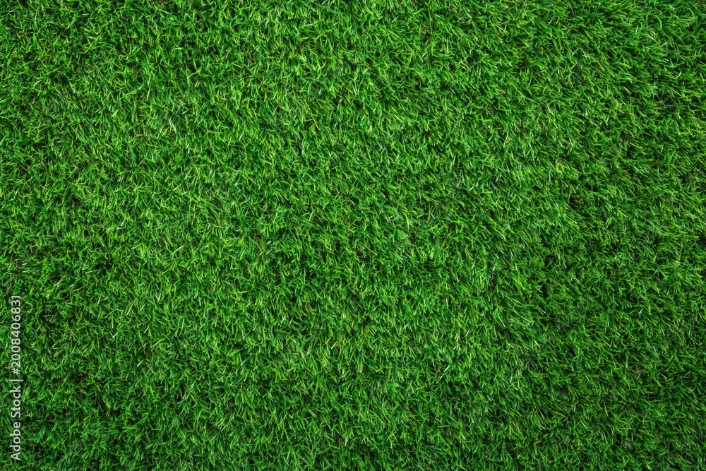 Fototapeta premium High resolution top view of green artificial grass turf texture for garden landscape design and sports field surface. High quality photo