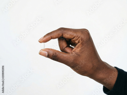 hand holding pill 