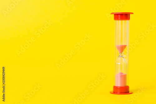 hourglass on the table, sand clock as time passing concept for business deadline, copy space