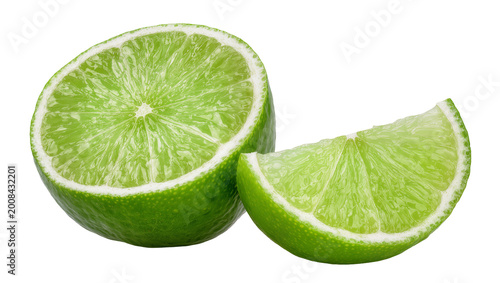Konstfotografi Bright green Lime slices one halved and one wedge, close-up