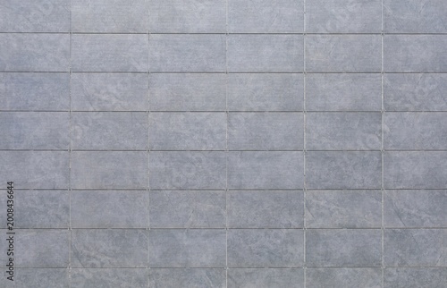Foto Light gray sintered stone tiles coating of a ventilated facade