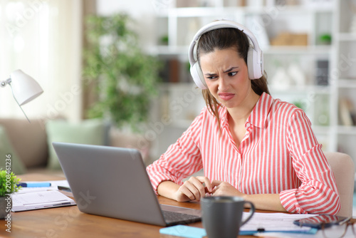 Confused tele worker working online making video call