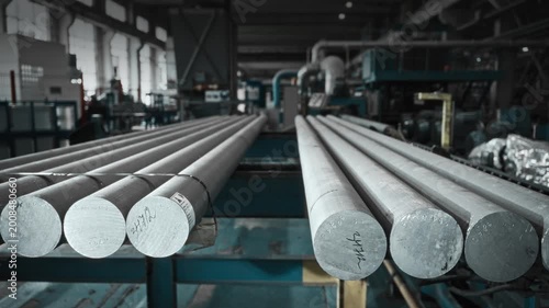 Detailed View Of Aluminum Castings On Production Line Amidst Warehouse Inventory And Equipment