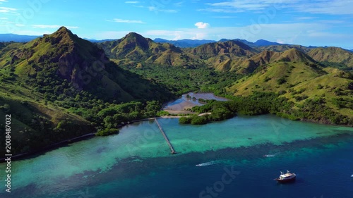 Komodo island landscape with boats in turquoise water. Perfect aerial view drone
