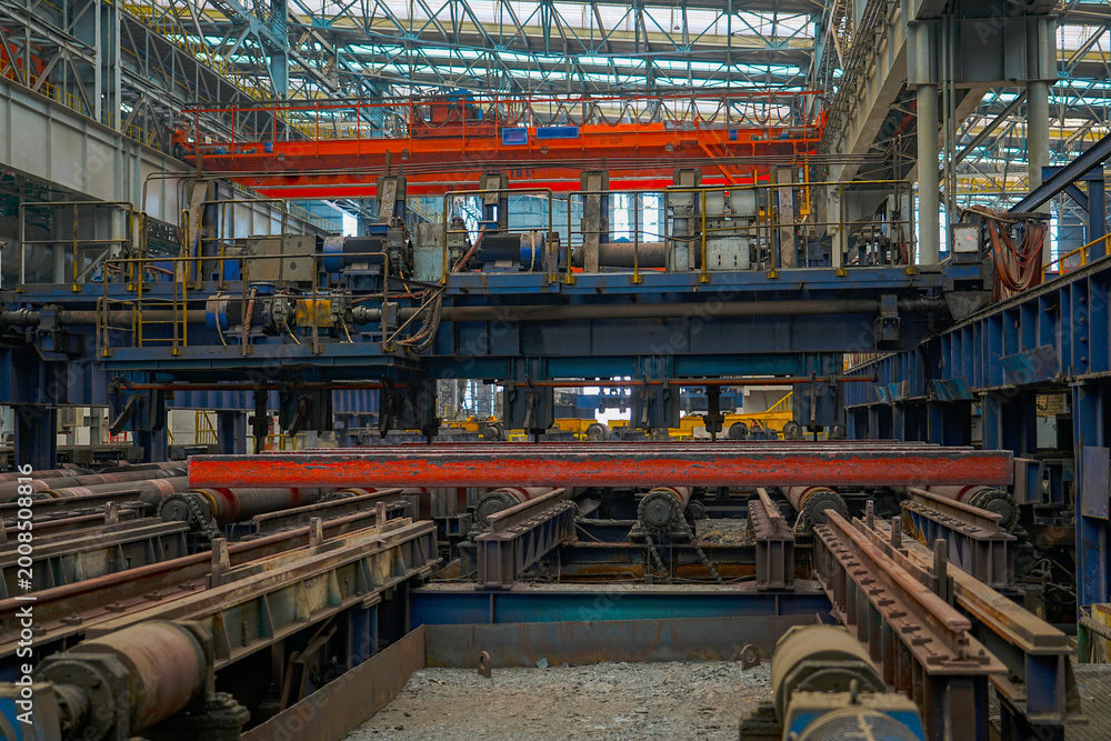Fototapeta premium The fiery steel billet, the core moment of the rolling mill production line