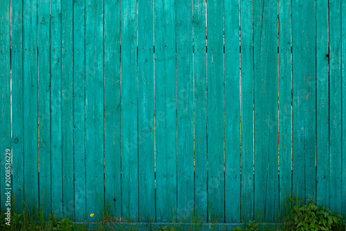 Old wooden green fence, background