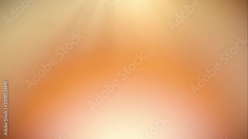 Radiant warm orange and yellow gradient background with soft glowing light rays and bokeh effect for serene atmosphere concept and positive energy
