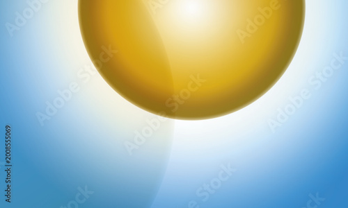 Golden sphere with radiant light on blue background, abstract concept