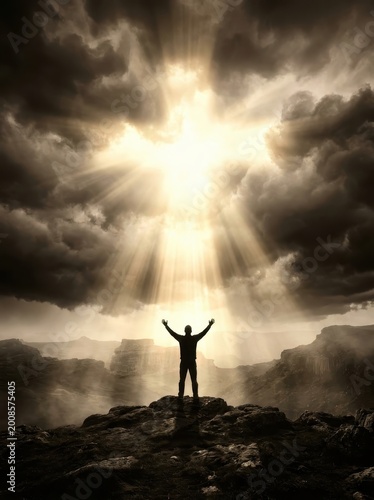 Silhouetted Man Embracing Light on Mountain Peak