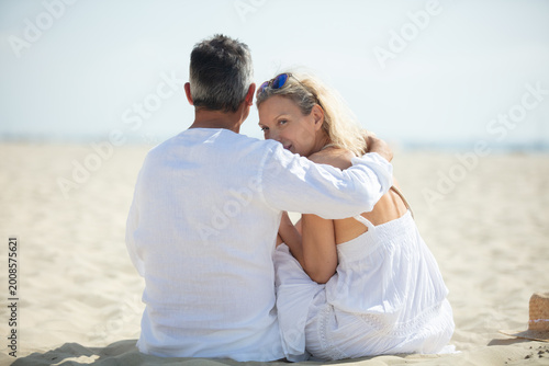 a senior couple enjoying beach holiday