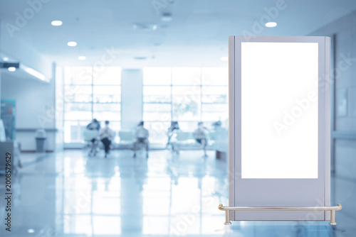 Photos Blank Digital Kiosk Mockup in Hospital Lobby with Waiting Area Background