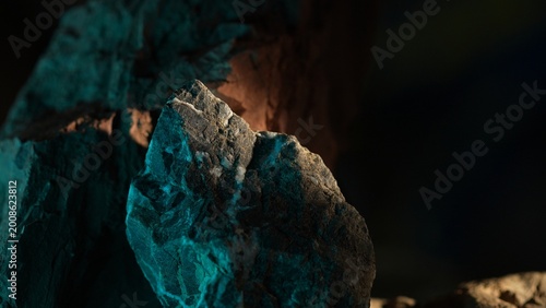 Photos Rock formation with warm backlight and teal shadow cinematic background